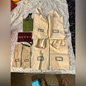 Lot of authentic Gucci cotton bags and paper